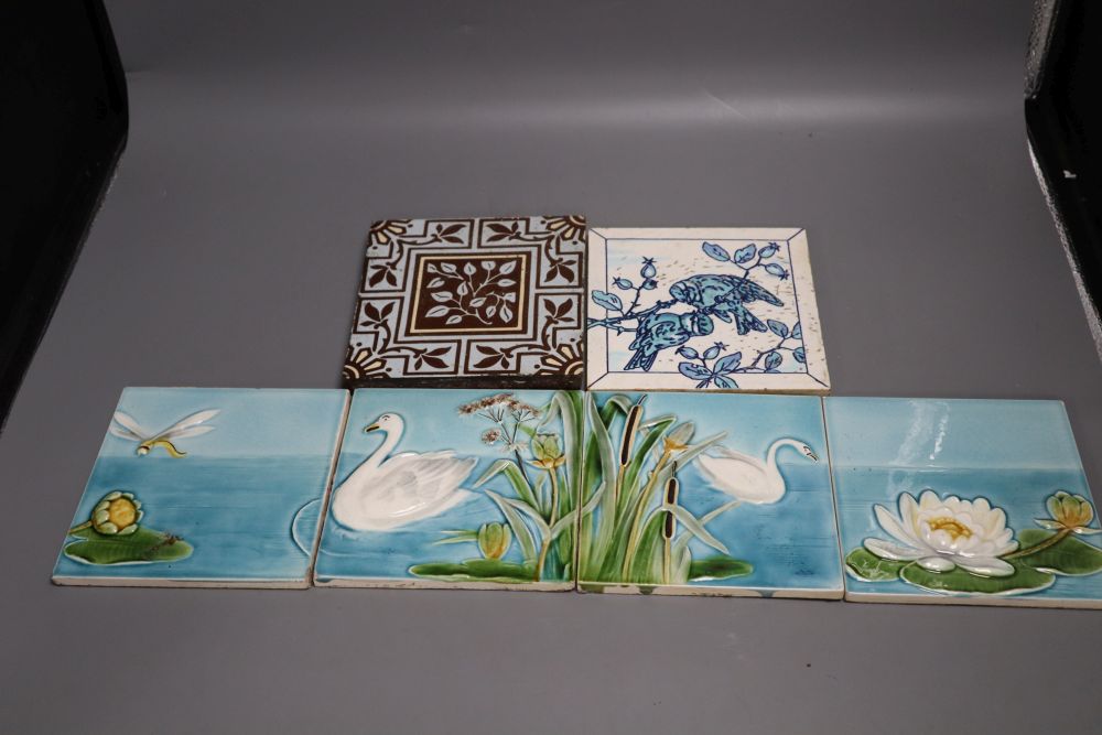 A set of four Victorian coloured tiles, 15cm and two other tiles